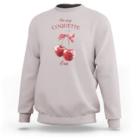 Ice gray sweatshirt with cherry and bow graphic at chest, crew neck