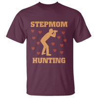 Maroon crew-neck T-shirt with “STEPMOM HUNTING” graphic and heart pattern