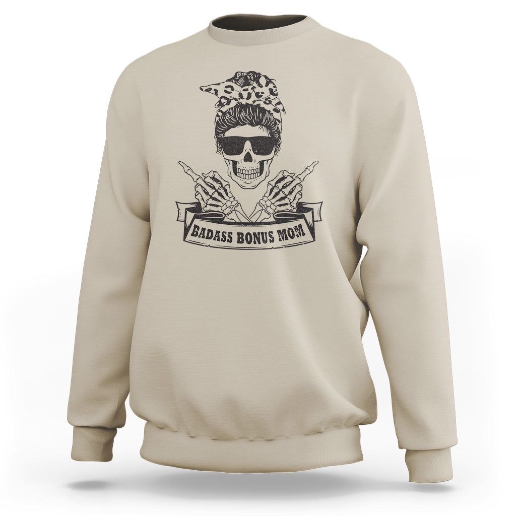 Bonus mom sweatshirt, sand/beige crewneck with skull graphic and “Badass Bonus Mom” print