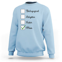 Light blue crewneck sweatshirt with adoption-themed list graphic and check mark