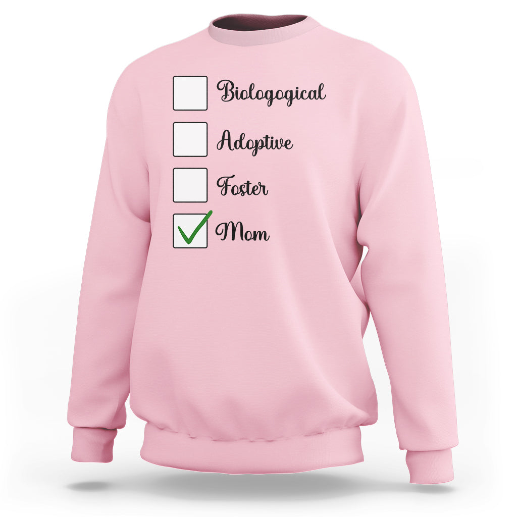 Light pink crewneck sweatshirt with adoption-themed list graphic and check mark