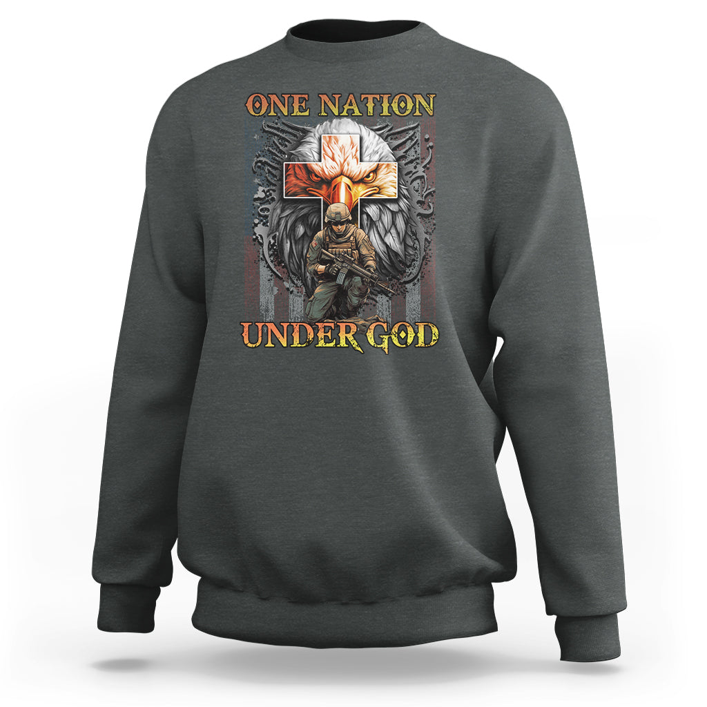 Dark heather crewneck sweatshirt with 'ONE NATION UNDER GOD' cross and wing graphic