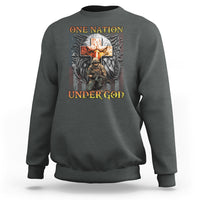 Dark heather crewneck sweatshirt with 'ONE NATION UNDER GOD' cross and wing graphic
