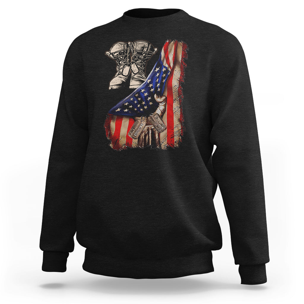Black sweatshirt with American flag graphic, combat boots and dog tags on the back