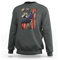 Dark heather gray sweatshirt with American flag graphic, combat boots and dog tags on the back
