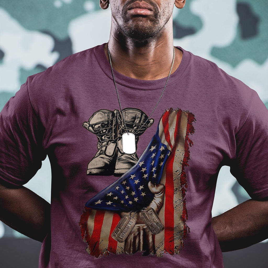 Maroon T-shirt with distressed American flag graphic, combat boots and dog tags