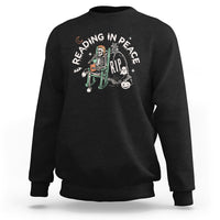 Black crewneck sweatshirt with RIP reading skeleton graphic on chest