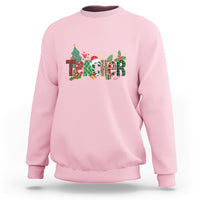 Light pink Christmas sweatshirt with colorful “Merry Xmas” graphic and crew neck