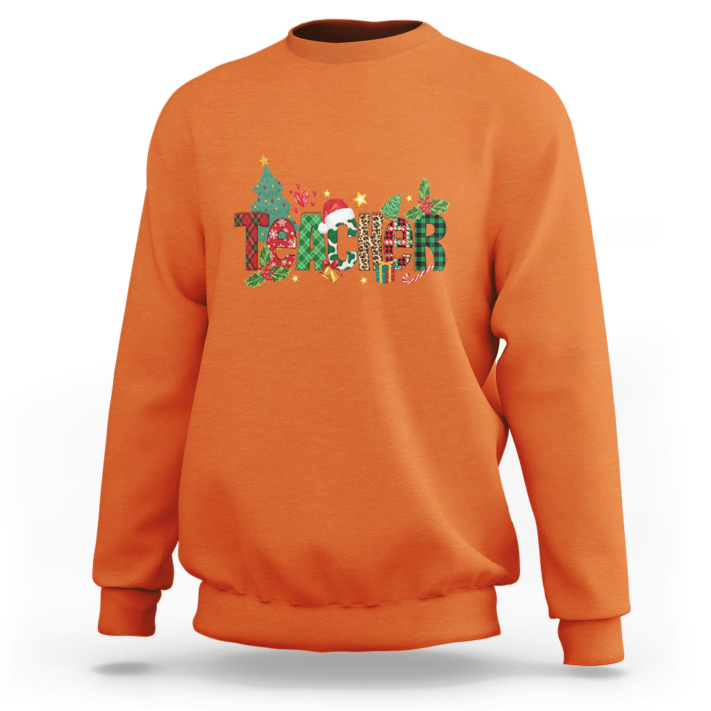 Orange Christmas sweatshirt with colorful “Merry Xmas” graphic and crew neck