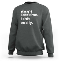 Dark heather crewneck sweatshirt with 'don't scare me. i shit easily.' print