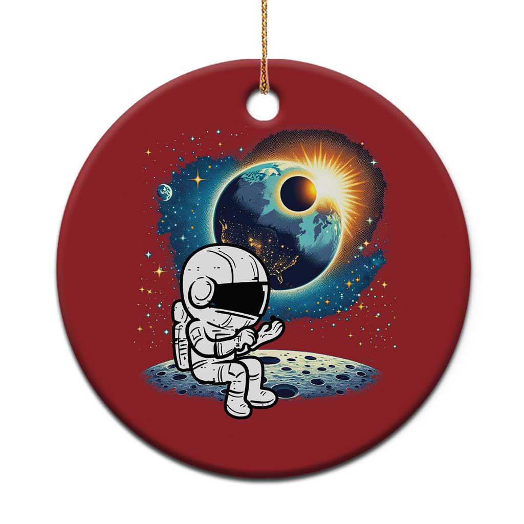 Red round astronaut space ornament with cartoon astronaut holding a globe planet