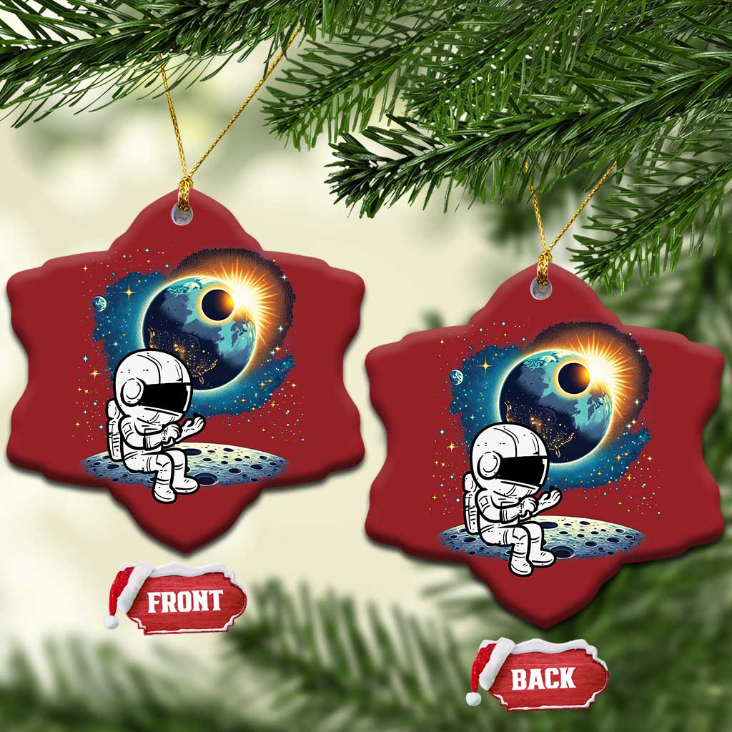 Two red heart-shaped astronaut space ornaments with front and back tags