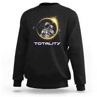 Black sweatshirt with astronaut graphic and “TOTALITY” text on the front