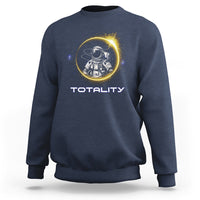 Navy sweatshirt with astronaut graphic and “TOTALITY” text on the front
