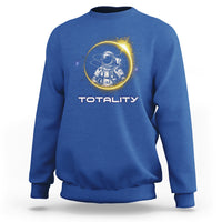 Royal blue sweatshirt with astronaut graphic and “TOTALITY” text on the front
