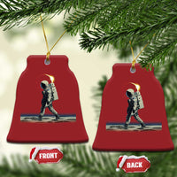 Set of red bell-shaped astronaut ornaments with gold hangers; front and back tags shown