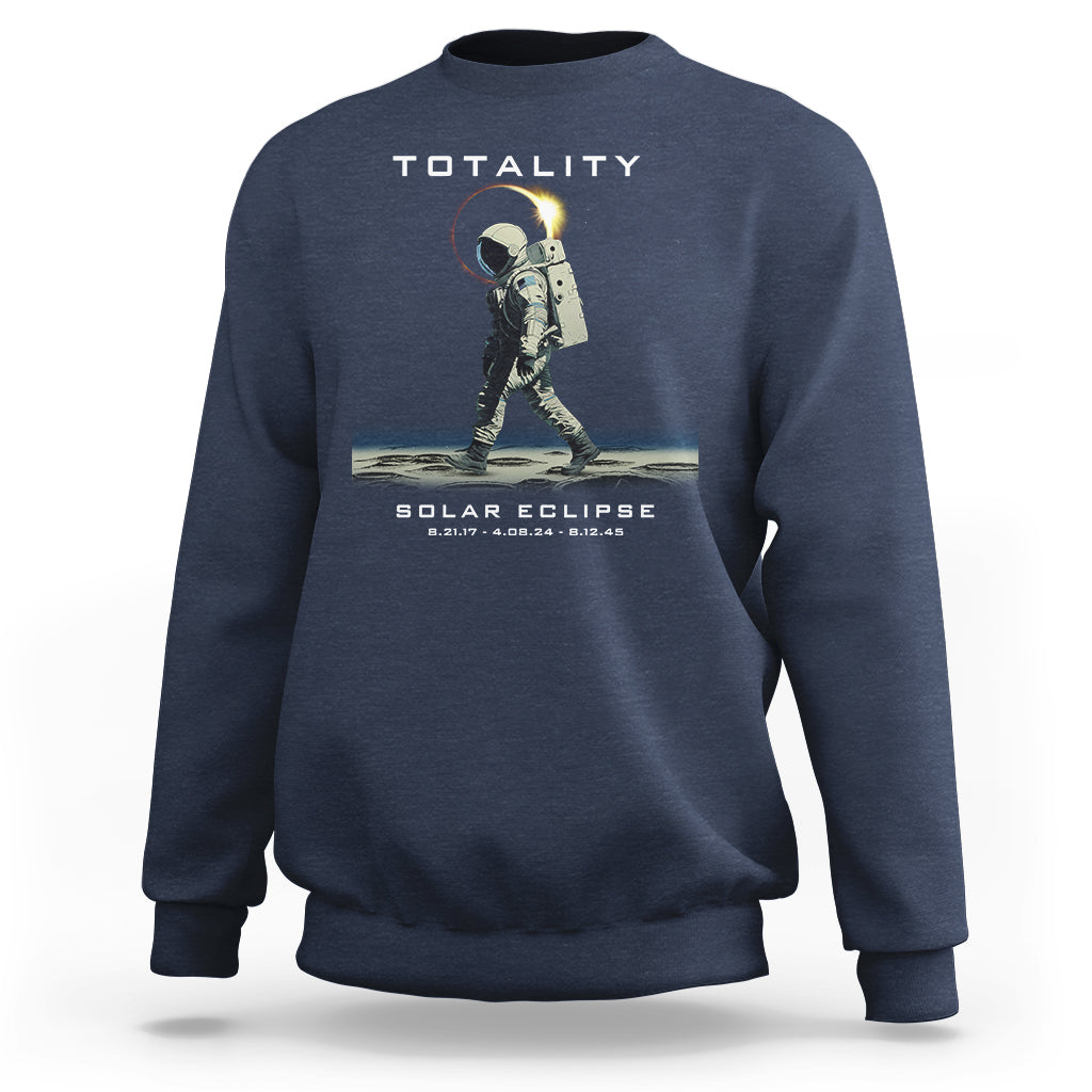 Blue crewneck sweatshirt with astronaut eclipse graphic and “TOTALITY” text on back