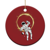 Red circular astronaut Christmas ornament with space helmet and glowing halo ring