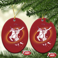 Pair of red oval Christmas ornaments with astronaut riding unicorn galaxy design