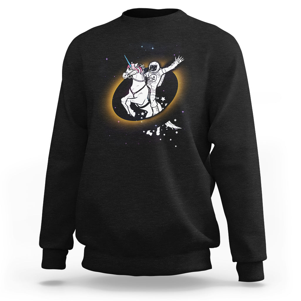 Astronaut sweatshirt in black with unicorn riding eclipse graphic on front
