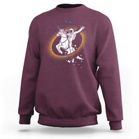 Astronaut sweatshirt in maroon with unicorn riding eclipse graphic on front