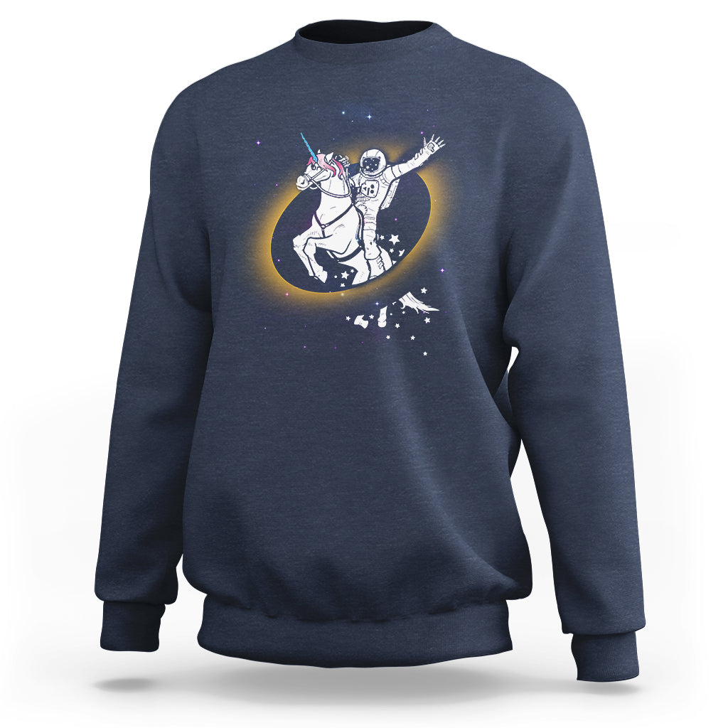 Astronaut sweatshirt in dark blue with unicorn riding eclipse graphic on front