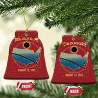Red bell-shaped solar eclipse map Christmas ornament with gold text and hanging loop