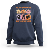 Navy Halloween reading sweatshirt with “GROW” phoneme graphic and orange text