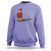 Violet crewneck sweatshirt with cartoon groundhog shadow graphic on chest.