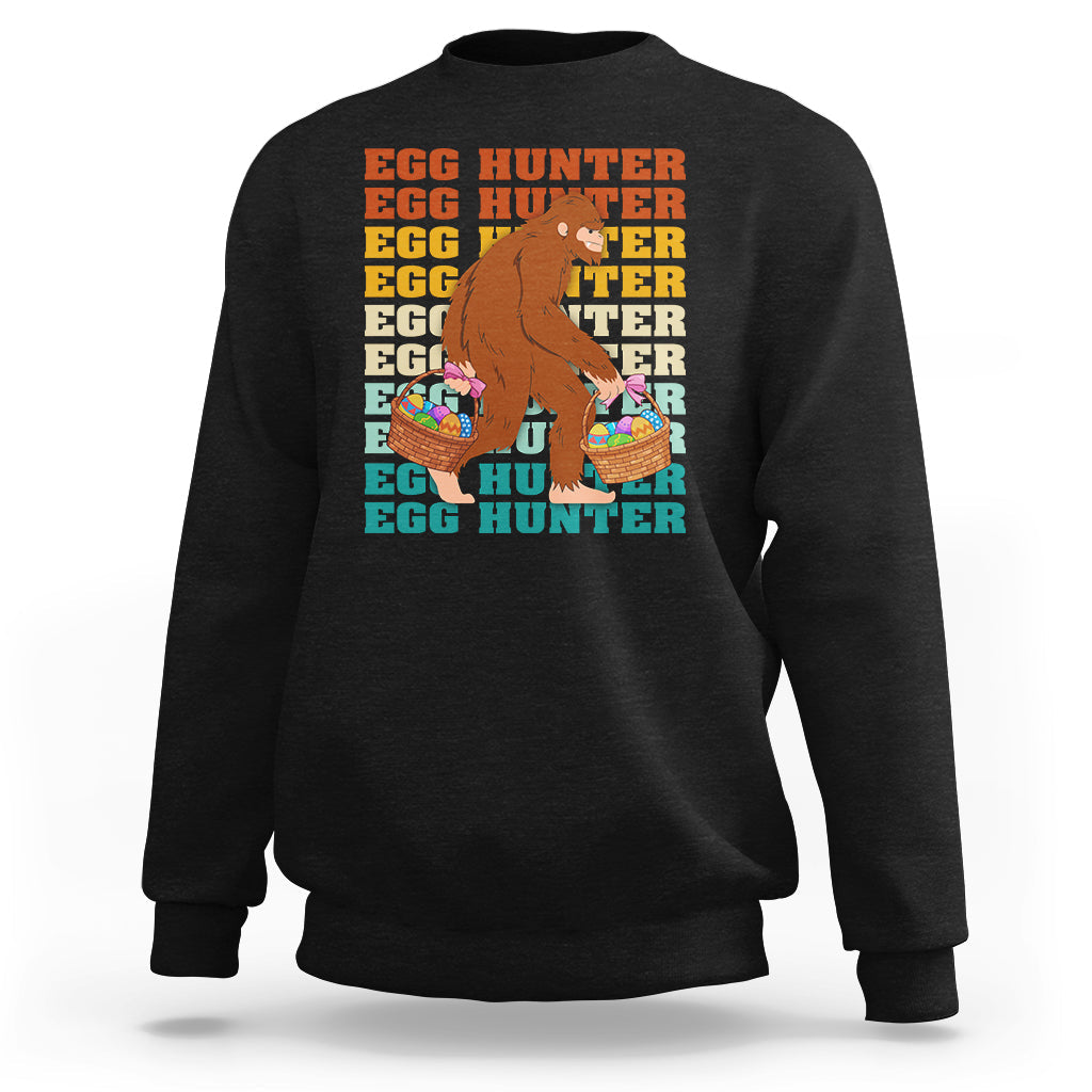 Kids long-sleeve crewneck sweatshirt, black; Bigfoot egg hunter graphic with baskets