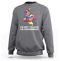Charcoal crewneck sweatshirt with colorful Colombia map graphic and 'I'm Not Yelling' text