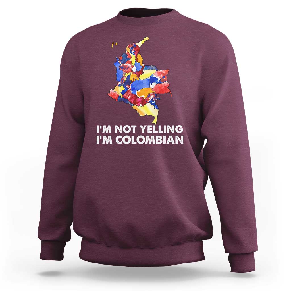 Maroon crewneck sweatshirt with colorful Colombia map graphic and 'I'm Not Yelling' text