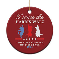 Red round Christmas ornament with gold string, dancer silhouettes, and 2024 text