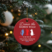 Red round Christmas ornament hanging from pine needles, with dancer silhouettes and 2024 text