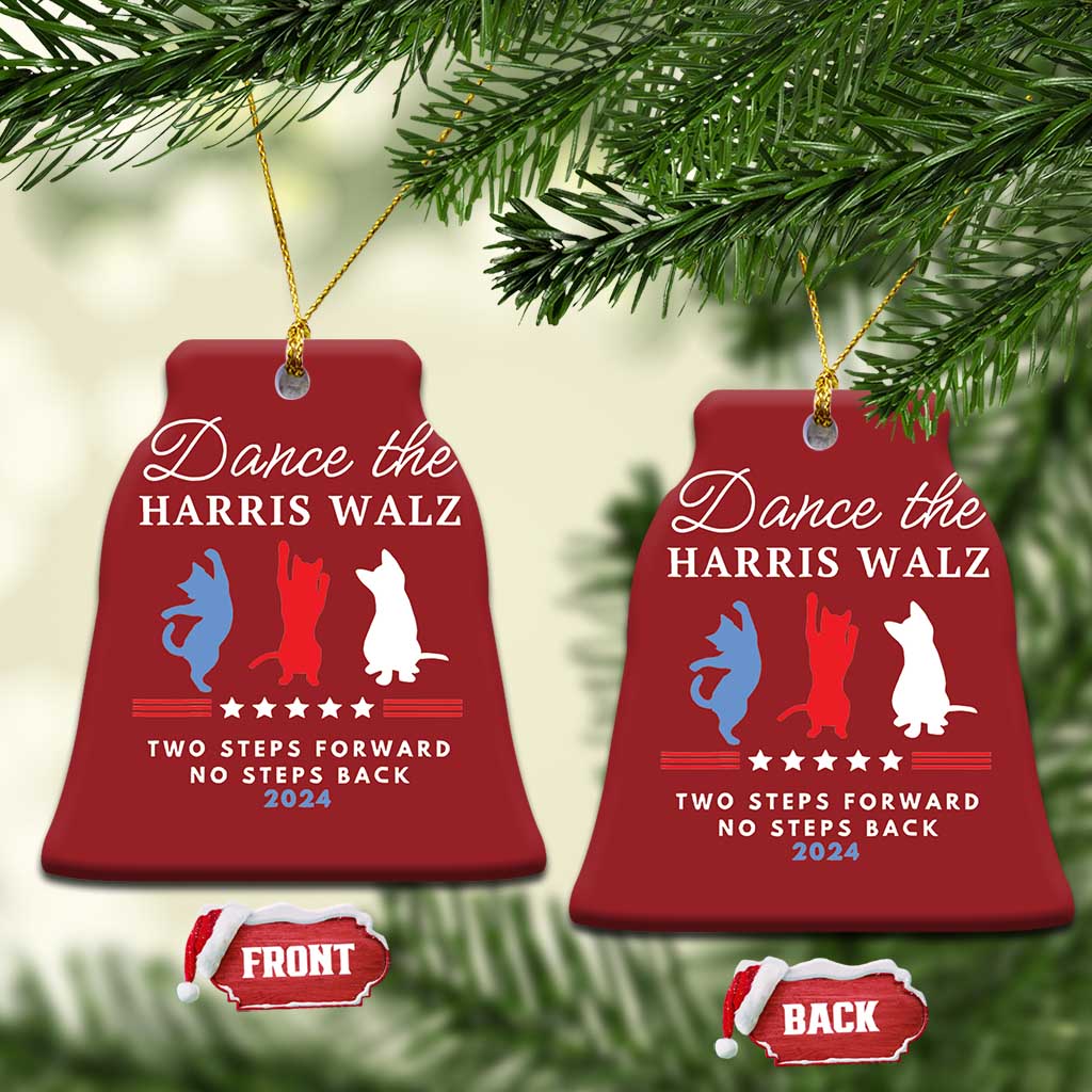 Pair of red bell-shaped Christmas ornaments hanging on pine, with dancer silhouettes and text
