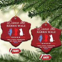 Two red heart-shaped Christmas ornaments hanging on pine, dancer silhouettes and 2024