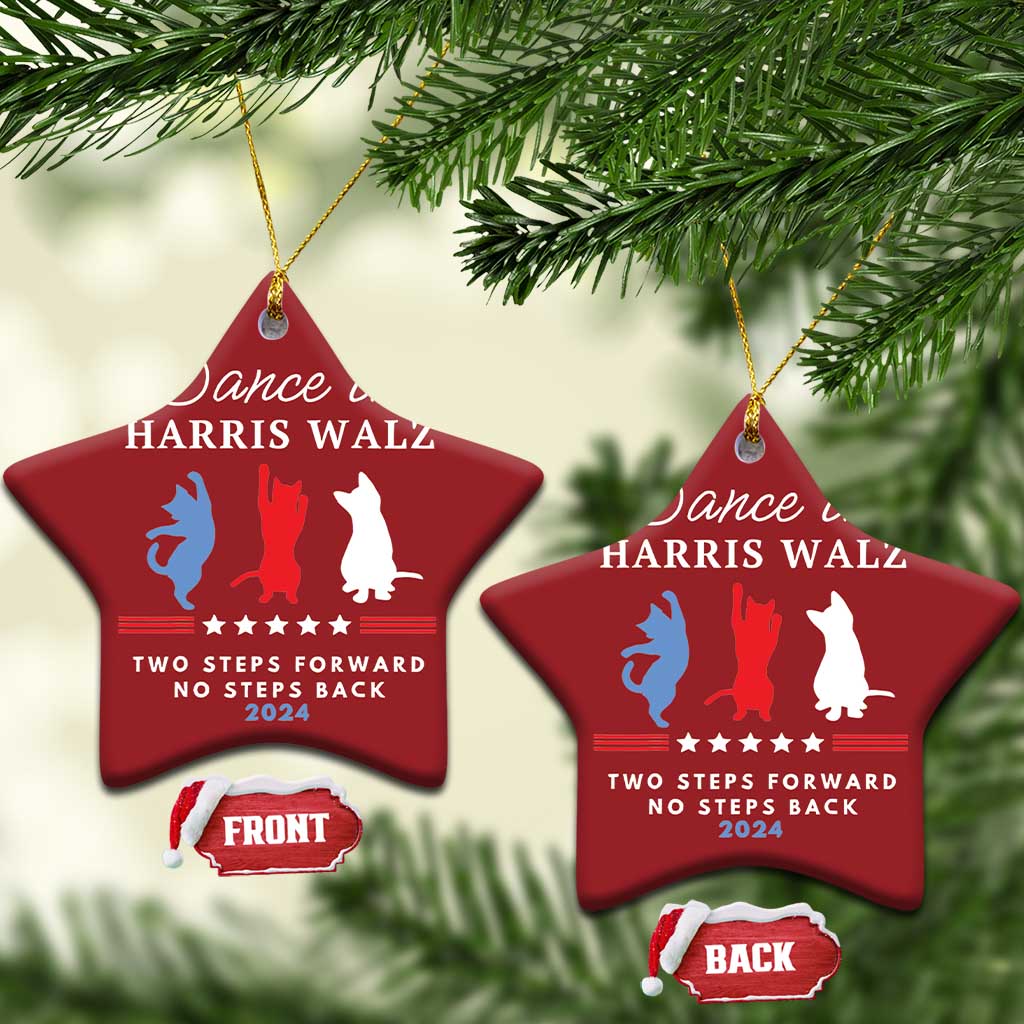 Two red star-shaped Christmas ornaments hanging on pine, with dancer silhouettes and 2024