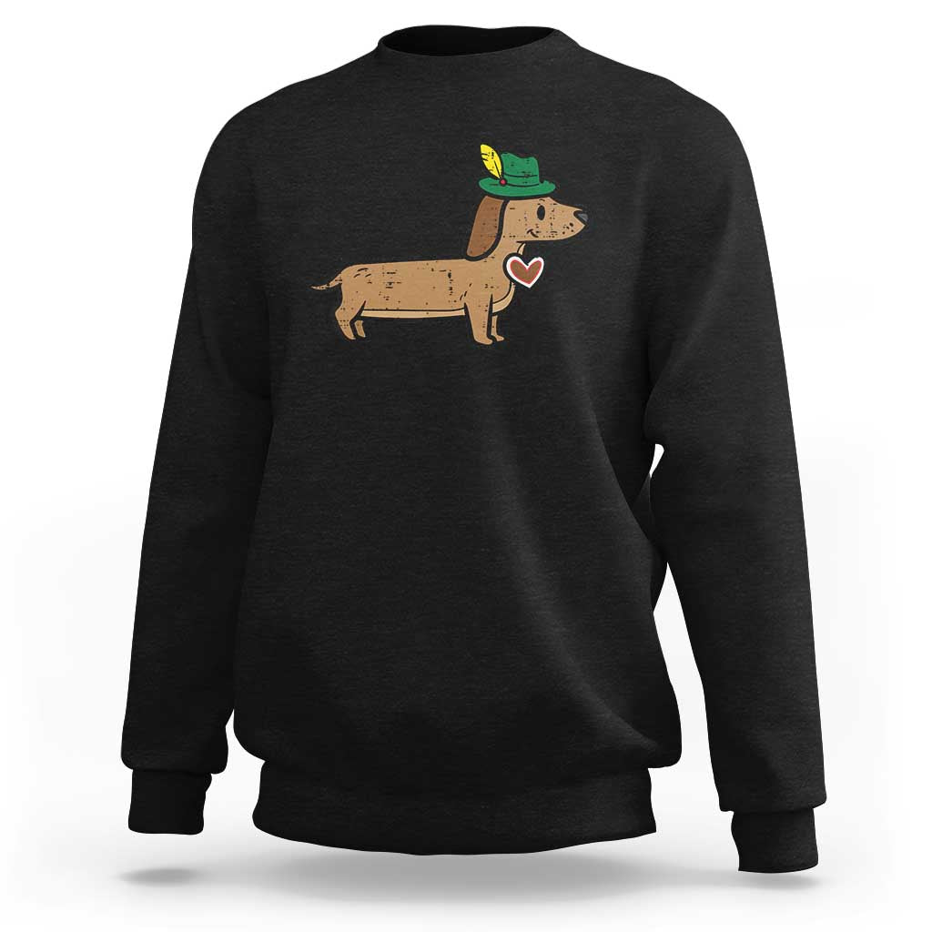 Black dachshund sweatshirt with green hat and small heart graphic on front.
