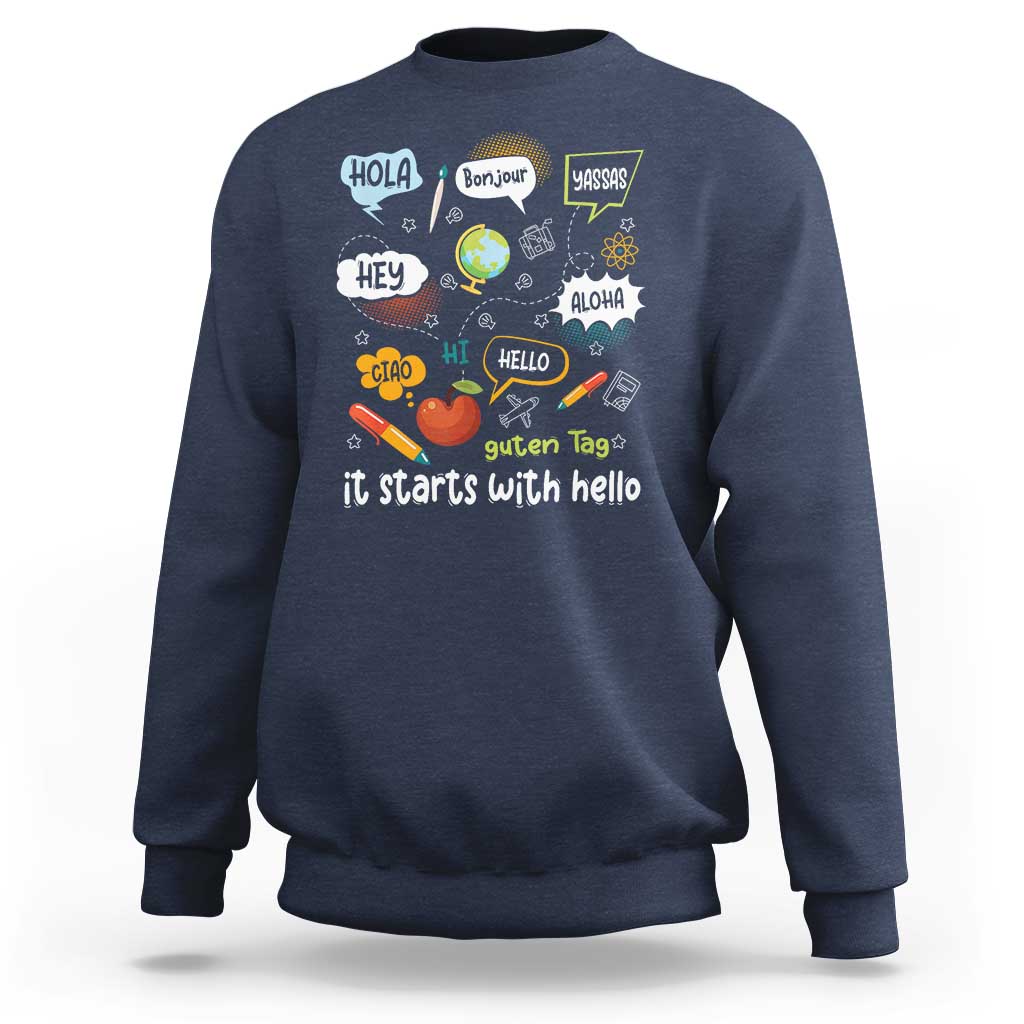 Inclusion Matters sweatshirt, navy crewneck with colorful multilingual “it starts with hello” graphic