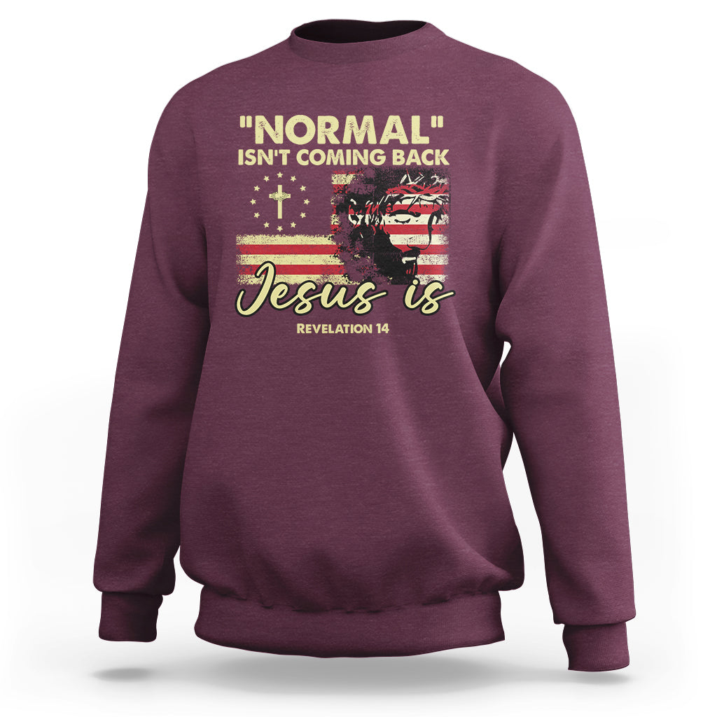Maroon crewneck sweatshirt with front religious quote graphic: "Jesus is"