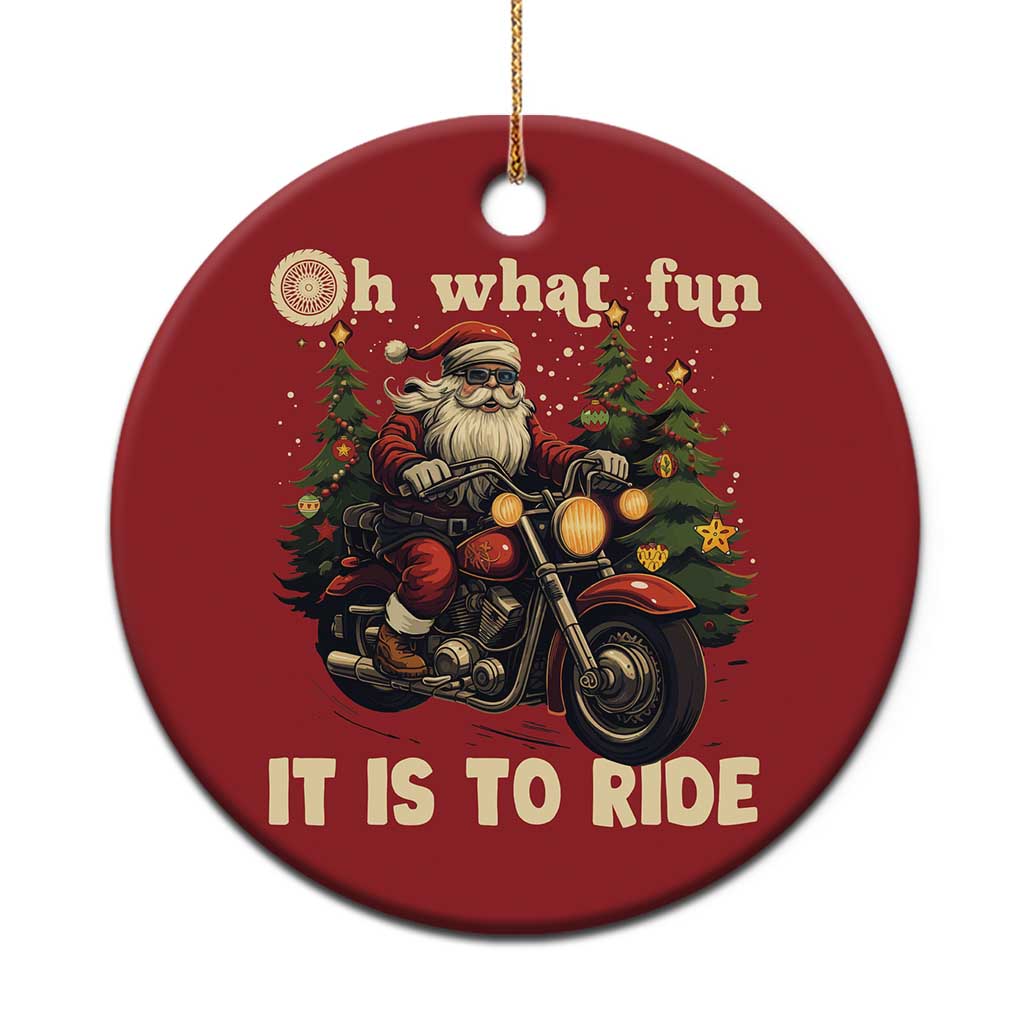 Red round Christmas ornament with Santa riding a motorcycle, “Oh what fun” and “It is to ride”