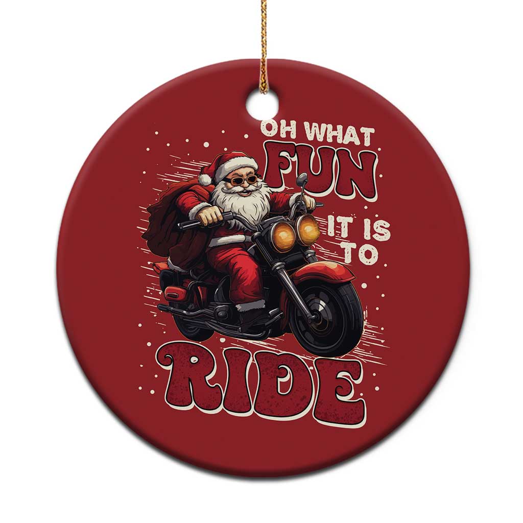 Red round Christmas ornament with biker Santa on motorcycle, reads “OH WHAT FUN IT IS TO RIDE”.
