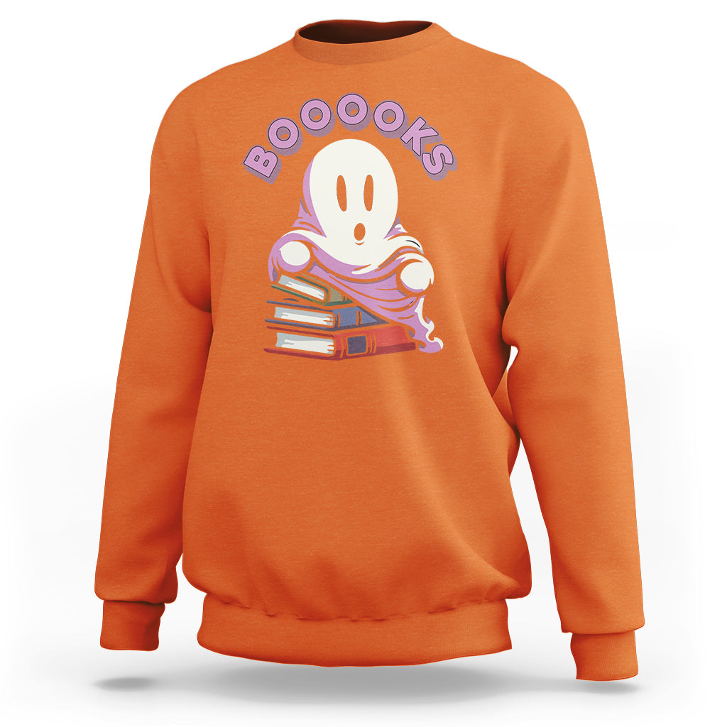 Orange ghost reading books sweatshirt with “Booooks” graphic on front