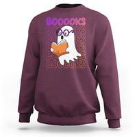 Maroon crewneck sweatshirt with ghost reading orange book and stacked 'BOOOOKS' lettering