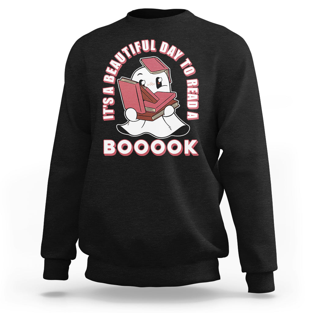Black Halloween sweatshirt with ghost reading book graphic and 'BOOOOK' text.
