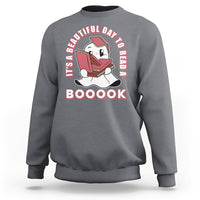 Charcoal gray Halloween sweatshirt with ghost reading book graphic and 'BOOOOK' text.