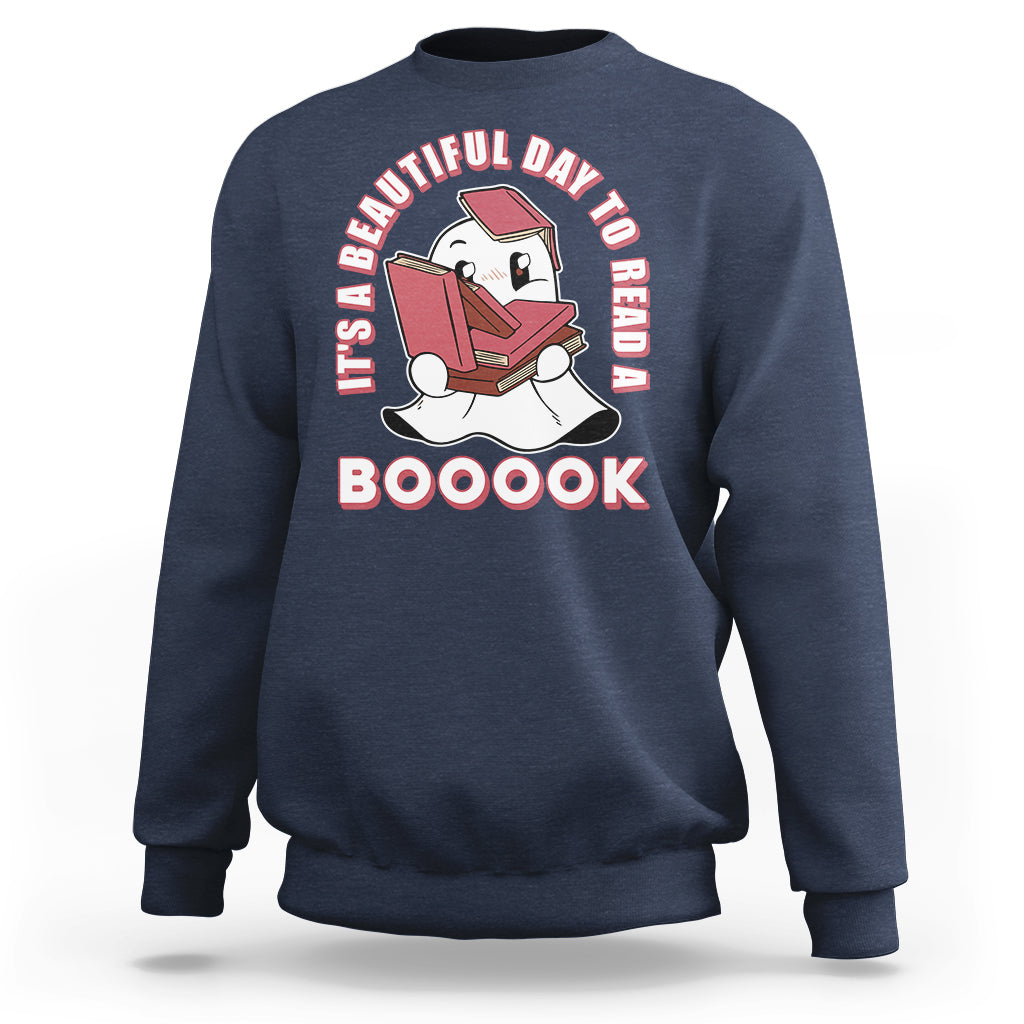 Navy Halloween sweatshirt with ghost reading book graphic and 'BOOOOK' text.