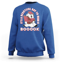 Royal blue Halloween sweatshirt with ghost reading book graphic and 'BOOOOK' text.