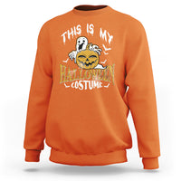 Orange crewneck sweatshirt with scary pumpkin Halloween costume graphic on front