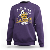 Purple crewneck sweatshirt with scary pumpkin Halloween costume graphic on back